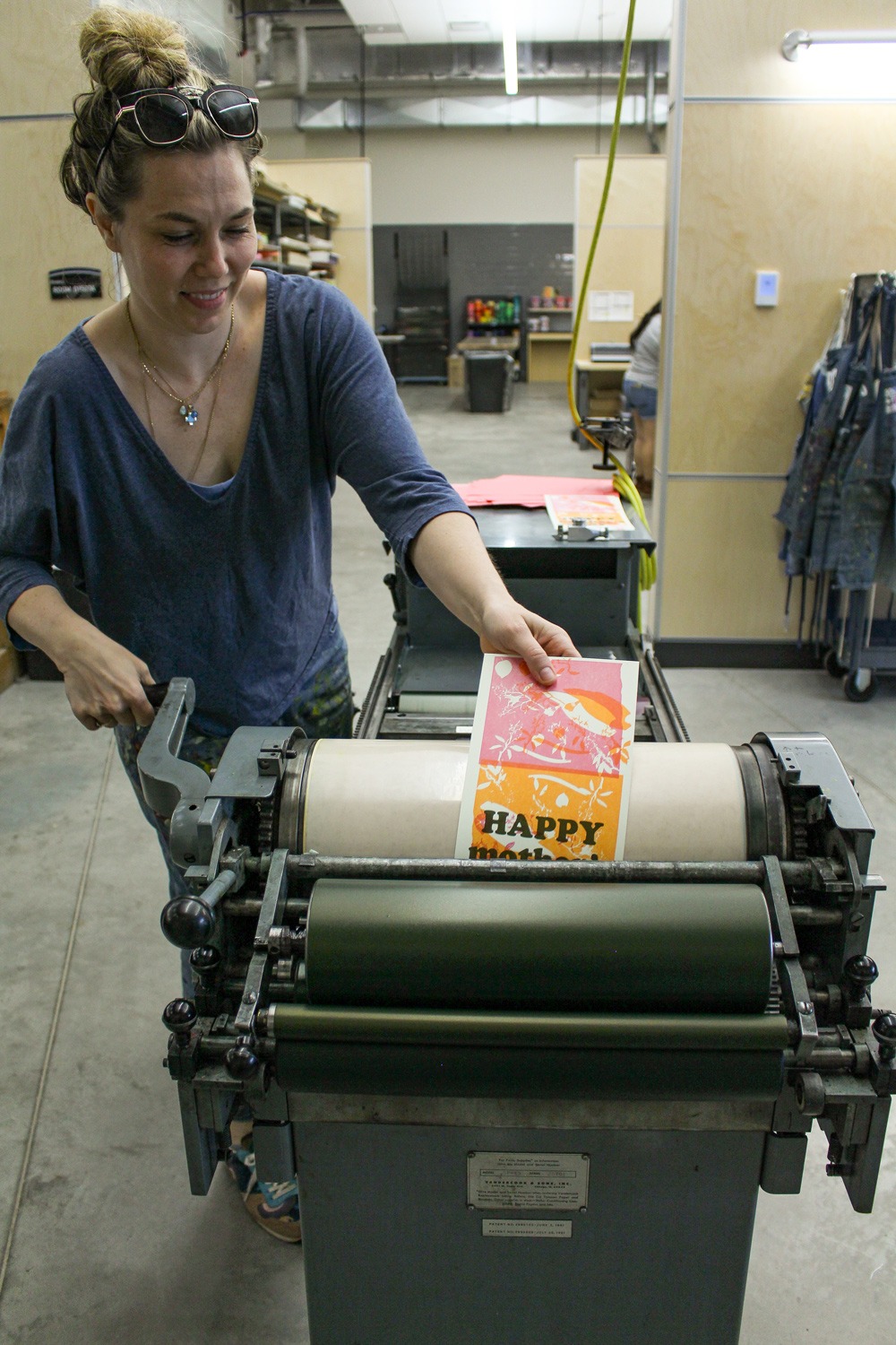 student using letterpress machine